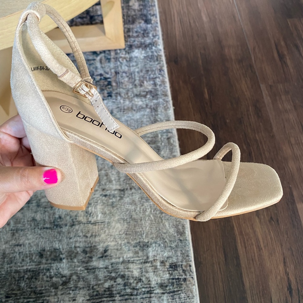 Brand new, never worn, open toe, thicker heel.